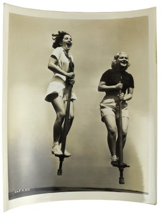 Item #46367 Silver Gelatin Photograph of Actresses on Pogo Sticks. Pogo Stick, Hollywood Actresses